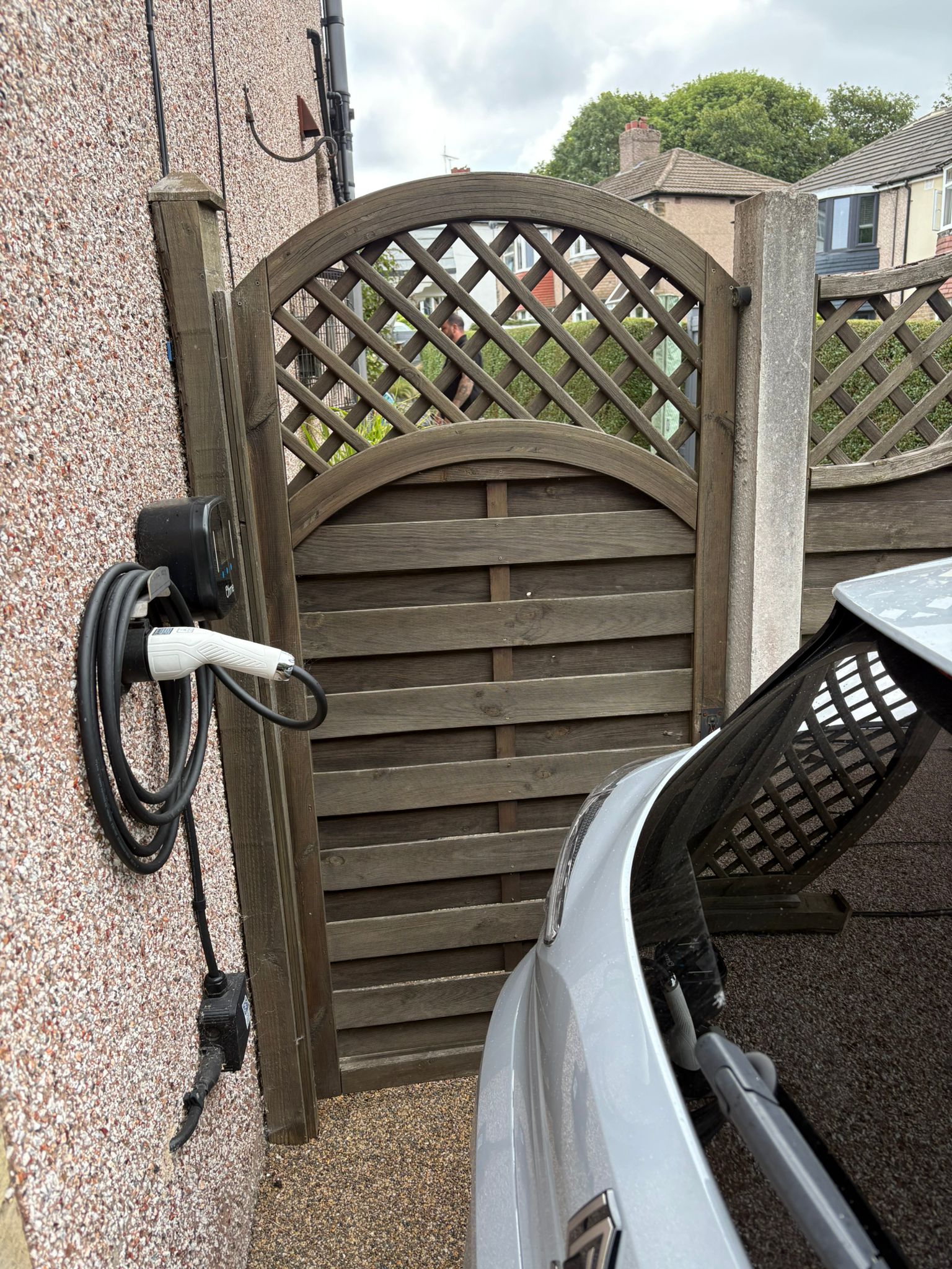 This image shows an old fence, ready to be upgraded to a new composite gate.