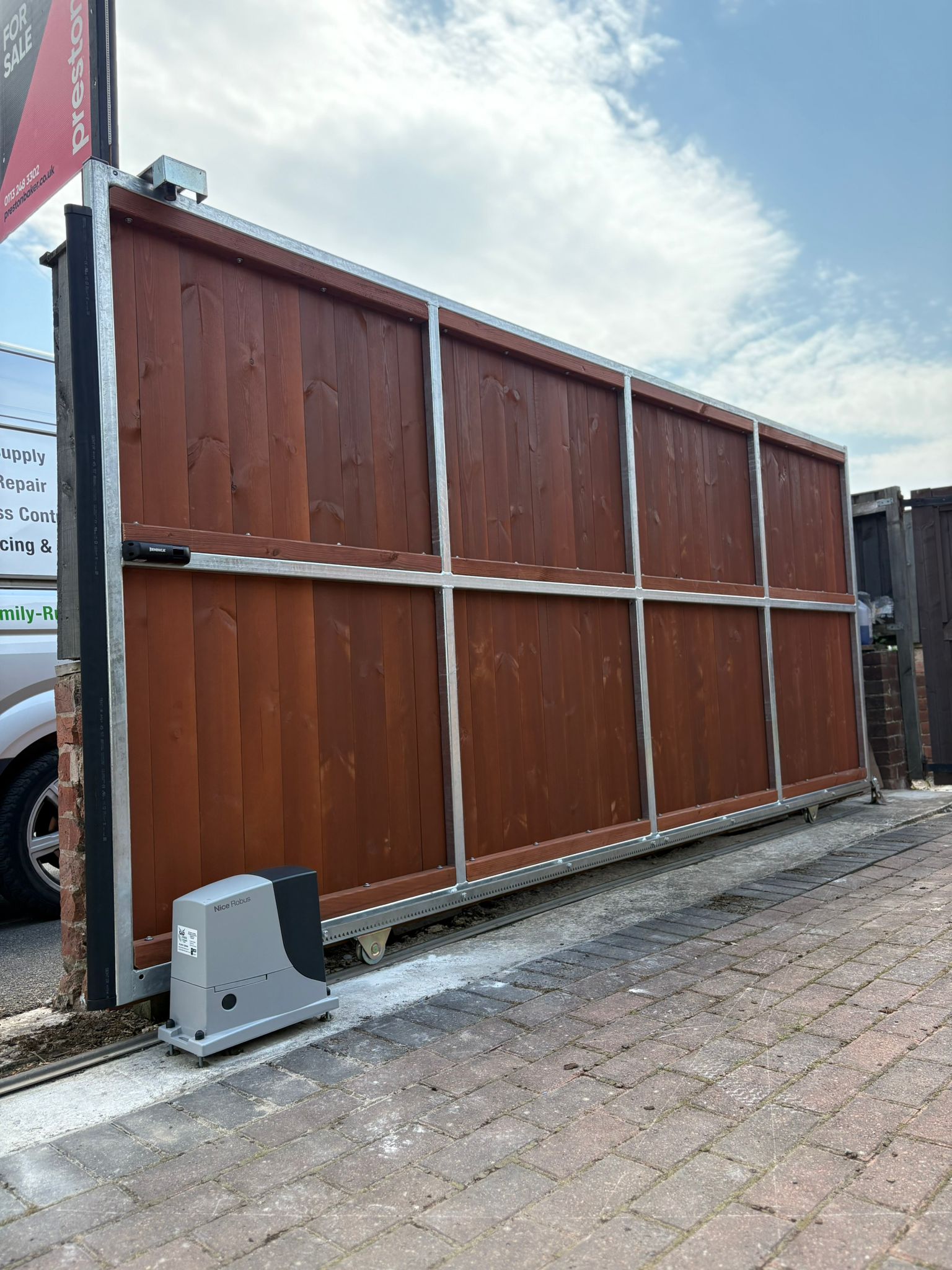 This image features a large automated sliding gate.