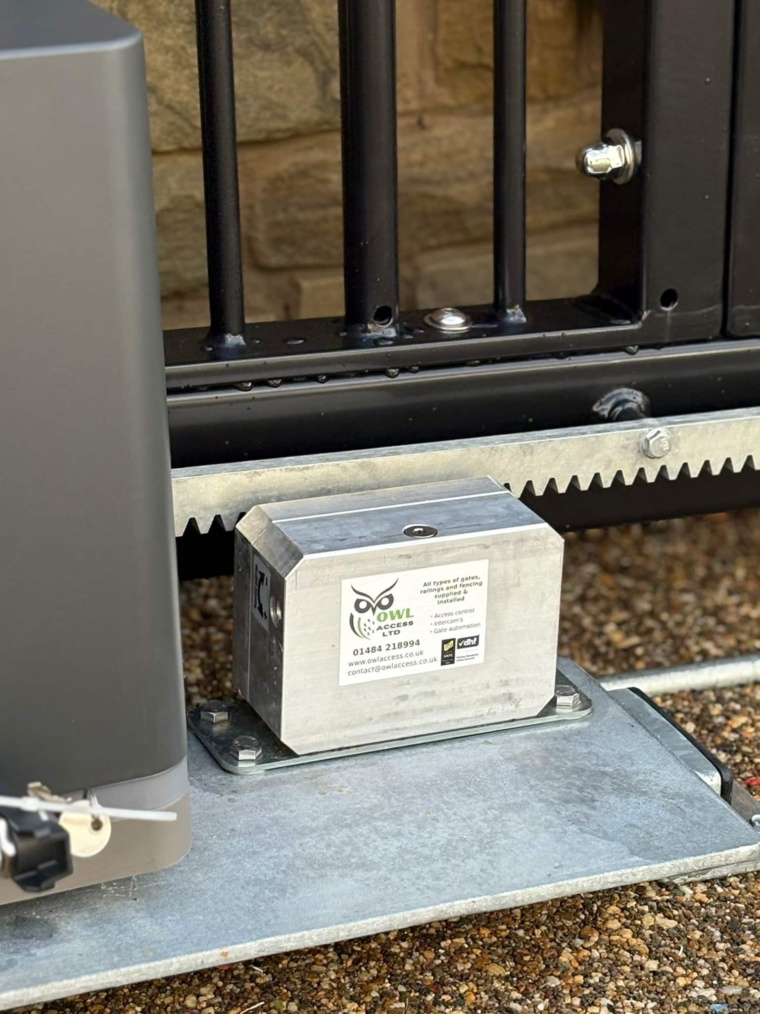 This image shows a close up of a hydraulic break, attached to a DEA Automated Gate system.