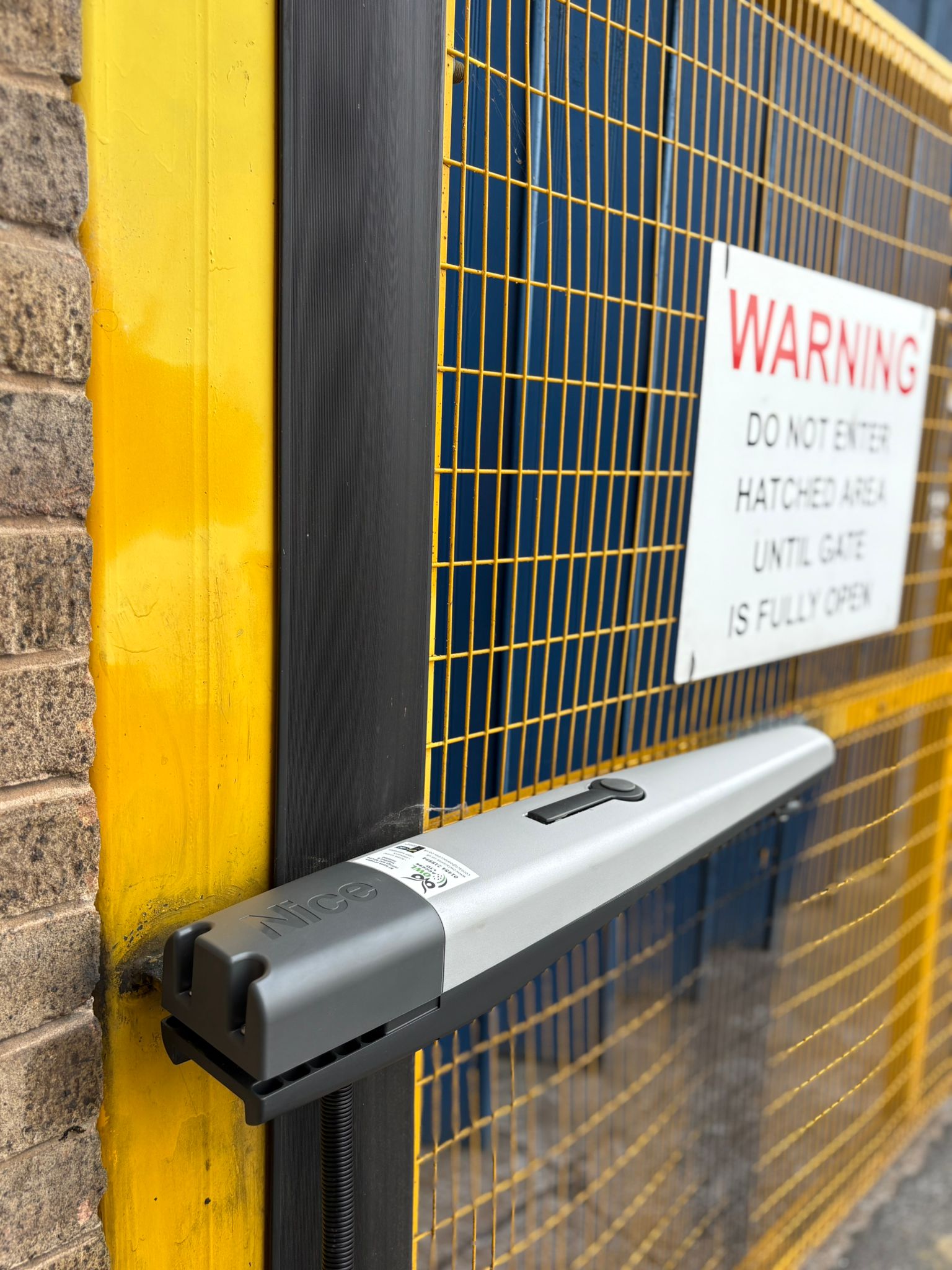 This image shows an automated gate with a Nice Hi-Speed system.