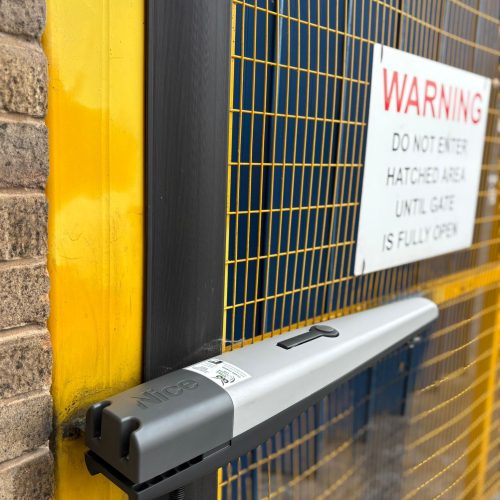 This image shows an automated gate with a Nice Hi-Speed system.